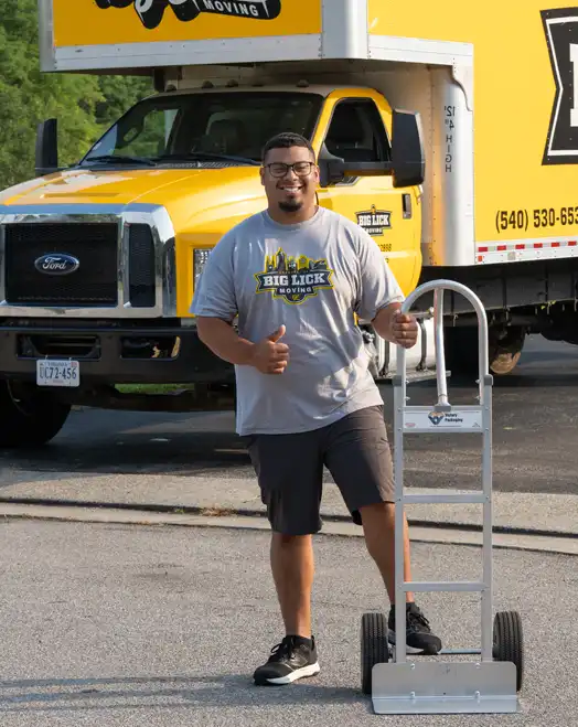 guy with dolly by moving truck